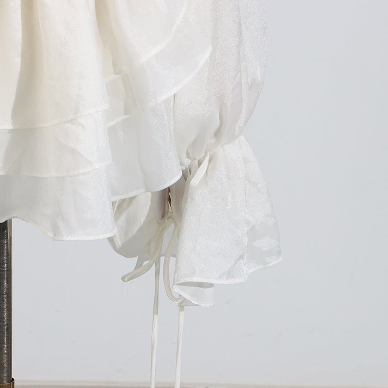 Elegant Short Lace Dress With Puff Sleeves in white featuring layered design and drawstring details