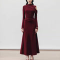 Elegant burgundy Silhouette Muse Pleated Knit Dress with long sleeves and a chic cutout design