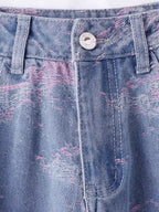 Close-up of Soft Pink Stitch Jeans featuring distressed denim and unique stitching detail