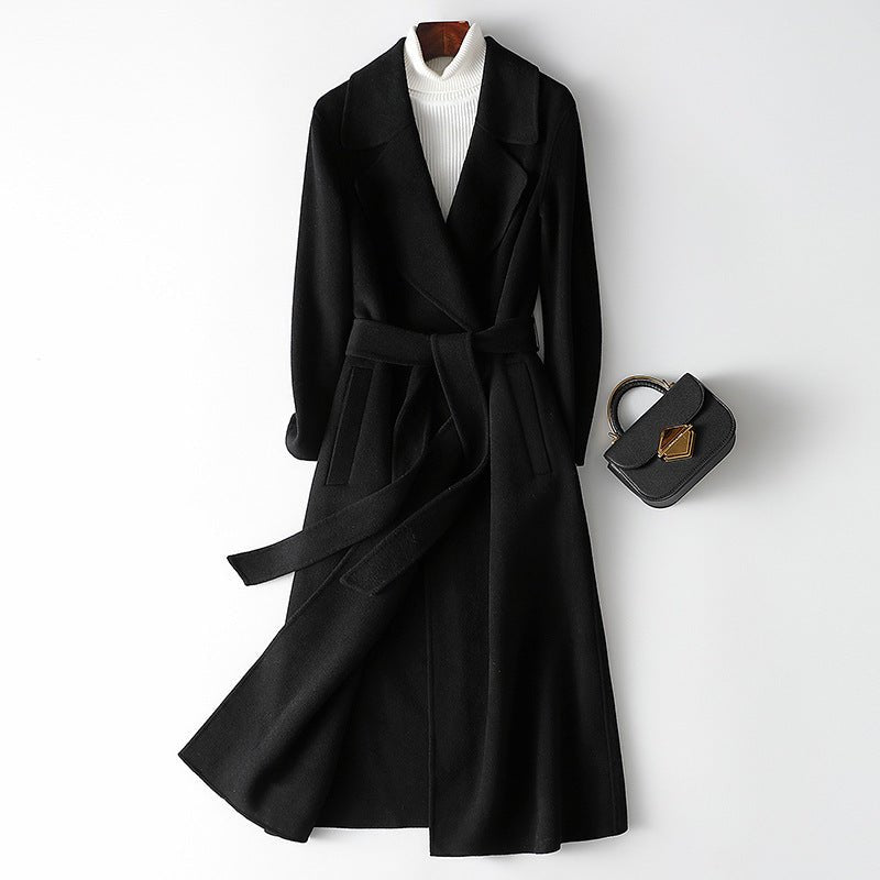 Elegant black Sophisticated Wool Coat with a belt and pockets, perfect for stylish winter attire