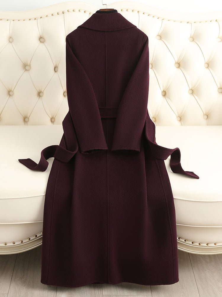 Elegant burgundy Sophisticated Wool Coat with a tie belt, ideal for stylish winter outfits