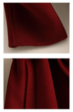 Close-up view of a rich burgundy Sophisticated Wool Coat showcasing luxurious fabric texture and tailored details