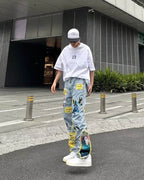 Model wearing AM Vision RO Straight Fit Jeans with Artistic Design in a trendy urban setting