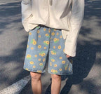 Men's summer streetwear floral shorts in blue denim with yellow flower print for casual style