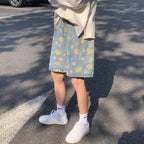 AM Vision RO summer streetwear floral shorts with a light blue background and vibrant flower patterns