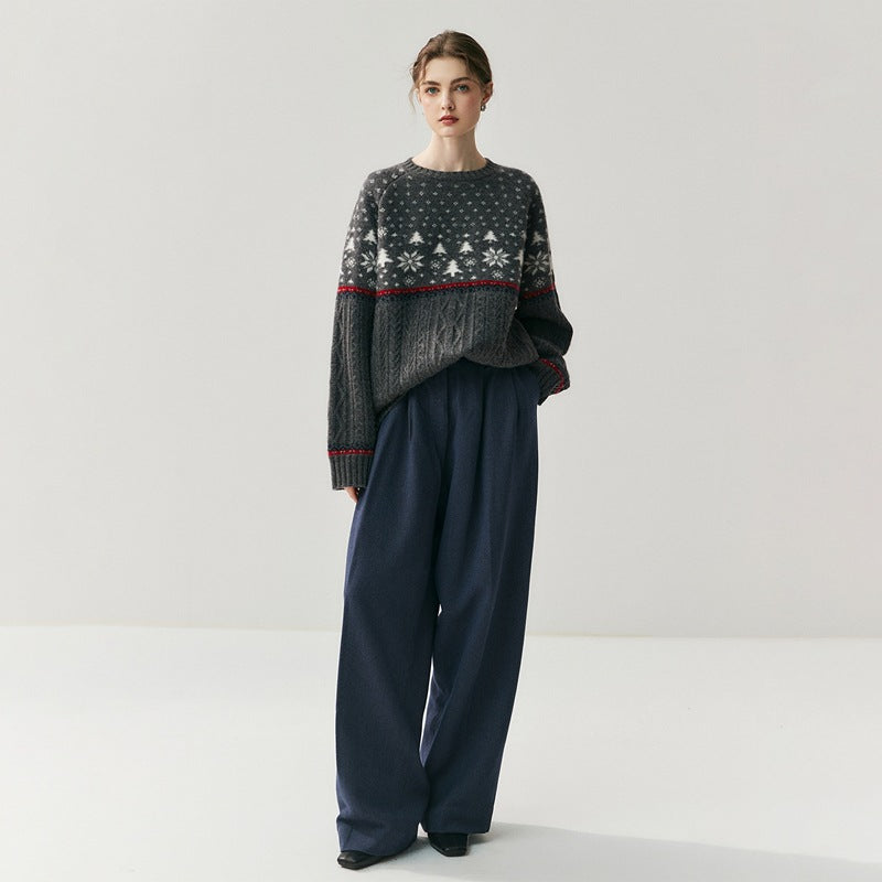 Cozy Christmas knitwear sweater with festive patterns, styled with loose navy pants for a relaxed holiday look