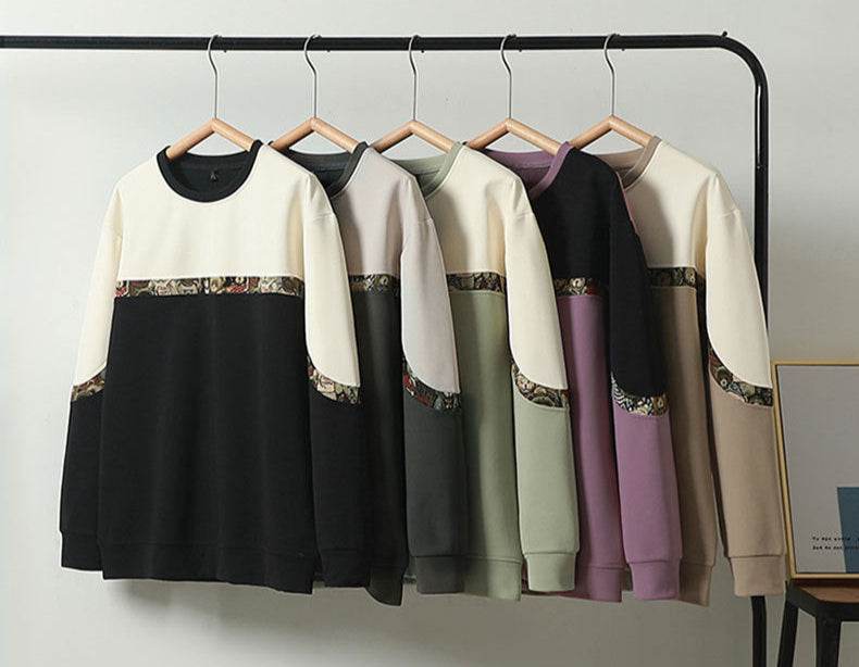 Sweater in Various Colors with Embroidered Bear Detail showcasing a stylish collection on hangers