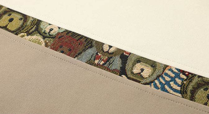 Sweater in Various Colors with Embroidered Bear Detail featuring a colorful bear design on a soft fabric