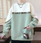 Green and cream sweater in various colors with embroidered bear detail, perfect for casual outings.
