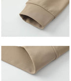 Close-up of sleeve detailing on AM Vision RO sweater in various colors with embroidered bear detail