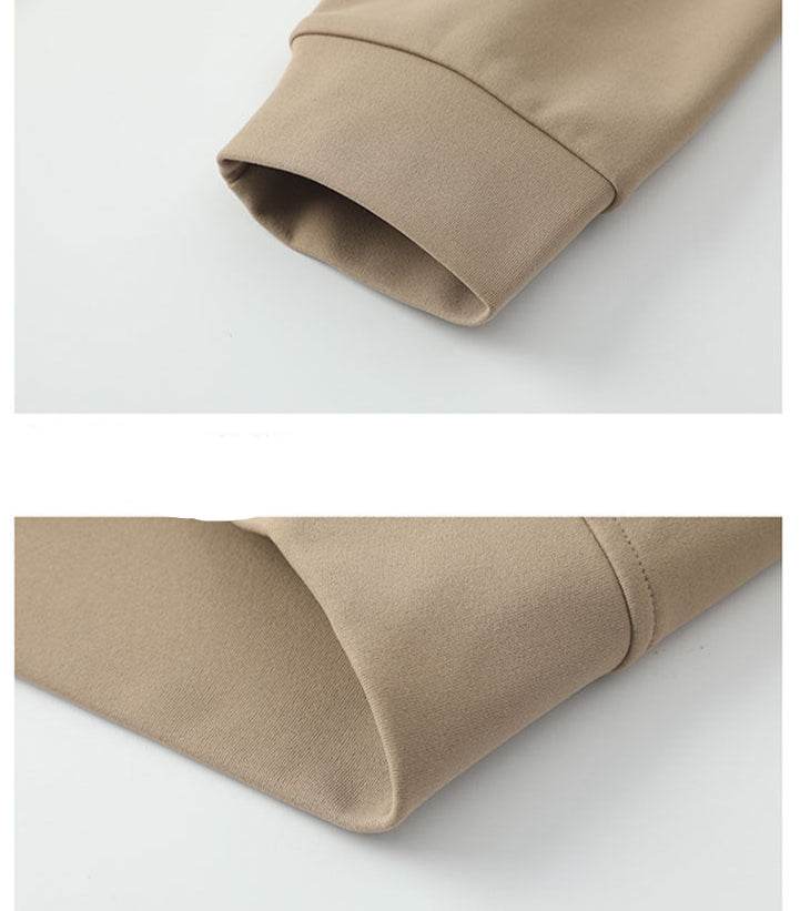 Close-up of sleeve detailing on AM Vision RO sweater in various colors with embroidered bear detail