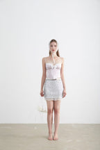Model wearing Sweet Desire Pink Bow Camisole with a silver skirt, showcasing a chic and elegant look