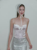 Model wearing the Sweet Desire Pink Bow Camisole with lace trim and stylish headscarf