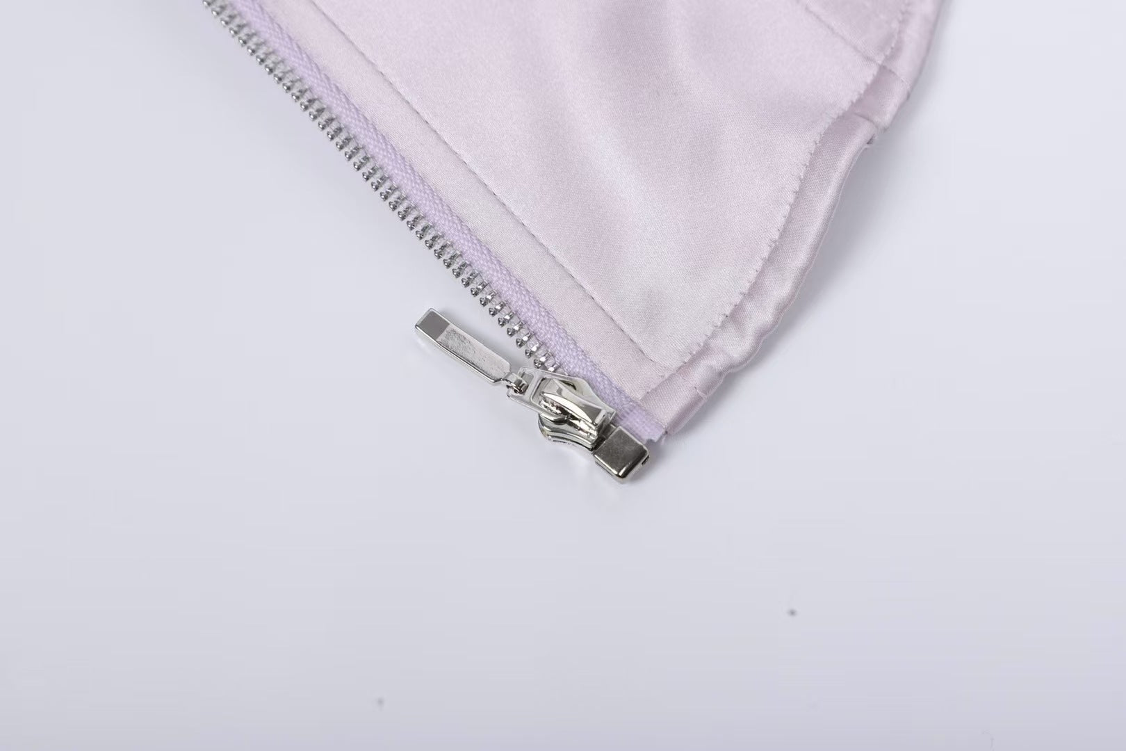 Close-up of the zipper detail on the Sweet Desire Pink Bow Camisole by AM Vision RO