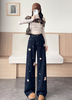 Teddy Stitch Wide Leg Jeans with unique embroidered designs in a stylish, relaxed fit