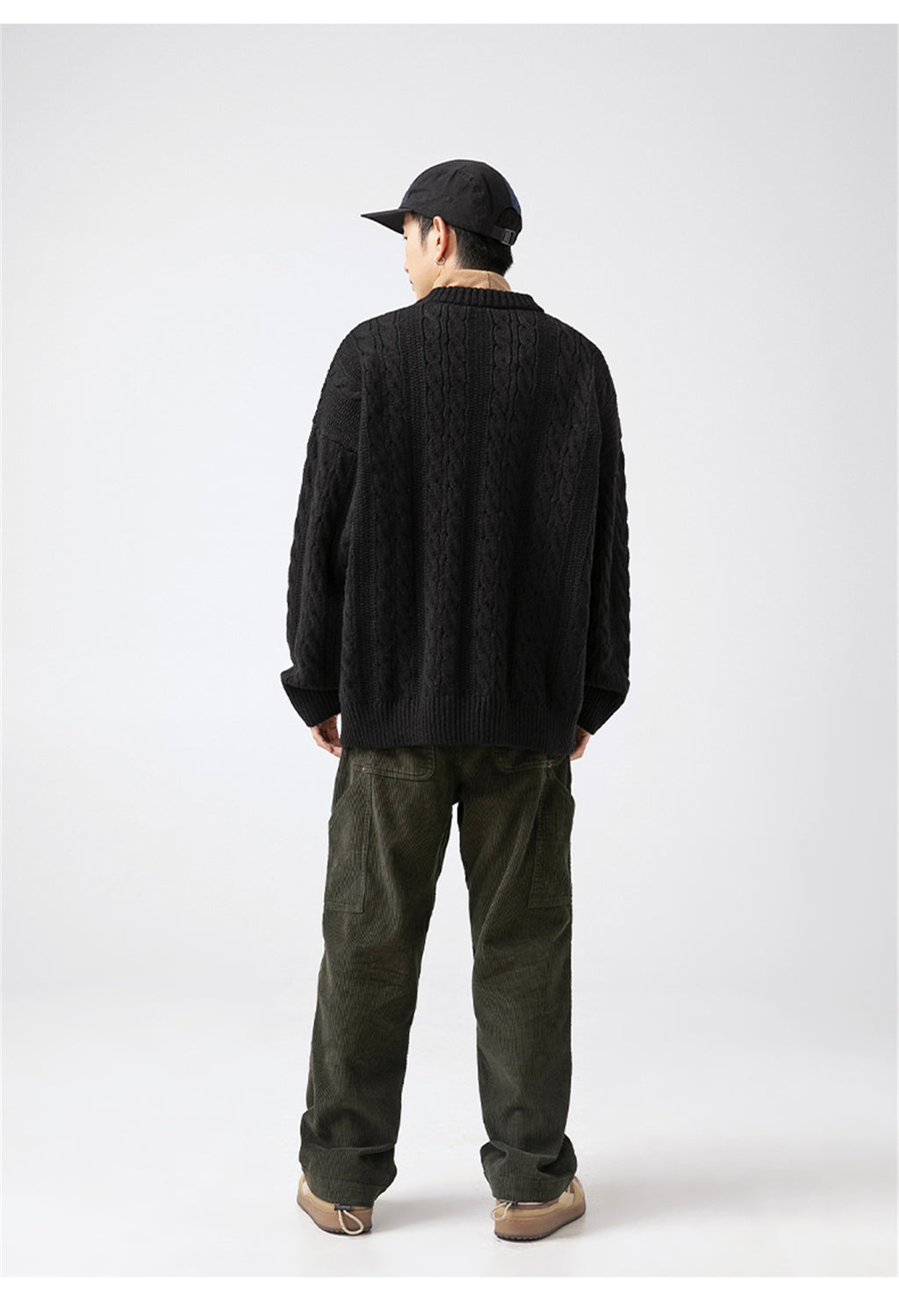 Men's black Textured Cable Knit Sweater featuring a relaxed fit and unique knit pattern