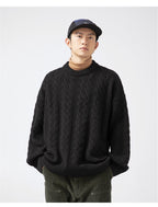 Casual model wearing a black Textured Cable Knit Sweater with loose fit and ribbed details