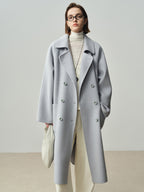 The Amaya Pastel Coat in soft grey with a classic double-breasted design and oversized silhouette