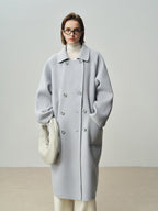 The Amaya Pastel Coat in light grey with oversized silhouette and elegant buttons for a chic look