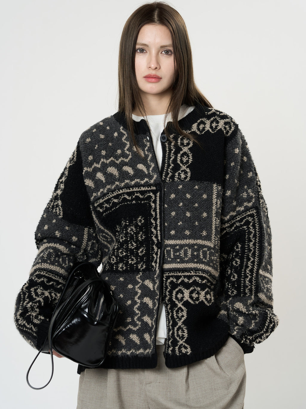The Kyoto Jacquard Cardigan in black and gray with unique patterns and oversized fit for stylish layering