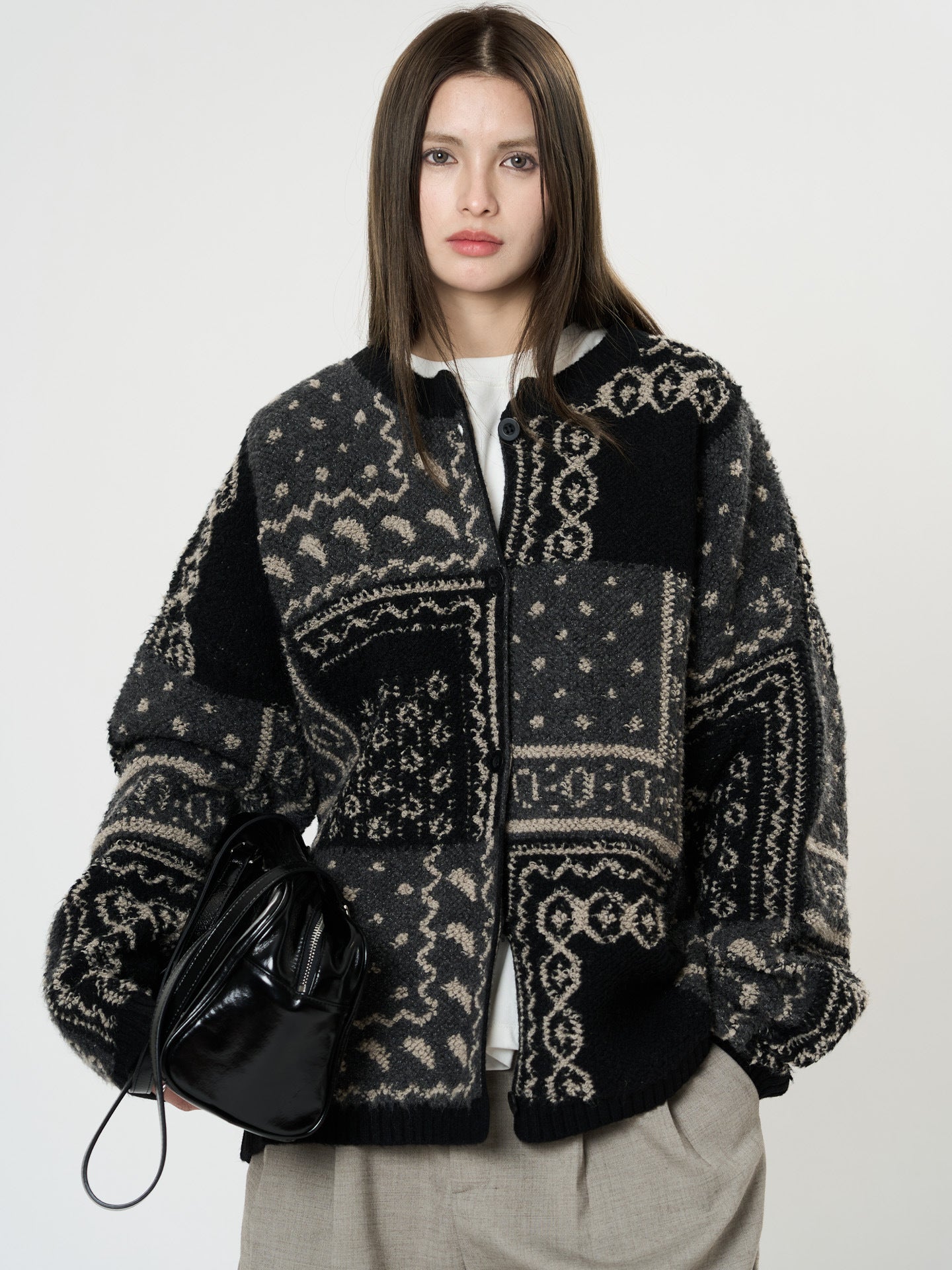 The Kyoto Jacquard Cardigan in black and gray with unique patterns and oversized fit for stylish layering