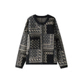The Kyoto Jacquard Cardigan featuring intricate patterns in black and cream for stylish layering