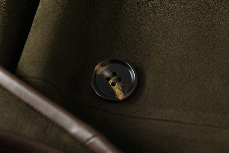 Close-up of The Margaux Trench Coat button showcasing its elegant design and quality craftsmanship