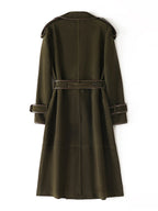 The Margaux Trench Coat in olive green with a belted waist and classic trench design