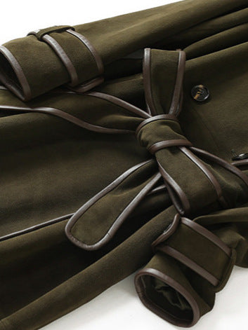 The Margaux Trench Coat in olive green with a stylish belt and elegant detailing