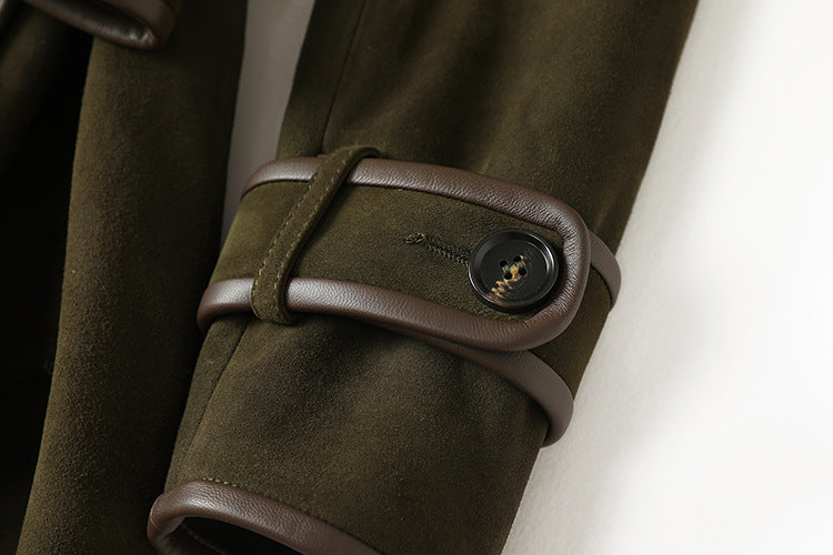 Close-up of The Margaux Trench Coat featuring stylish brown leather detailing on cuffs