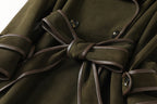 The Margaux Trench Coat in olive green with a stylish belted waist and elegant detailing
