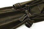 The Margaux Trench Coat in olive green with stylish belted design and elegant detailing