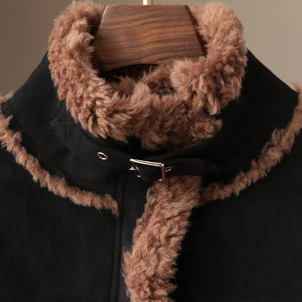The Panther Wool Coat with a plush, fluffy collar and stylish black bodice for a cozy look