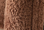 Close-up of The Panther Wool Coat showcasing its soft, fluffy texture in rich brown color