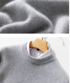 Thick Natural Wool Sweater With Elastic Hem in Light Gray Hanging on a Wooden Hanger