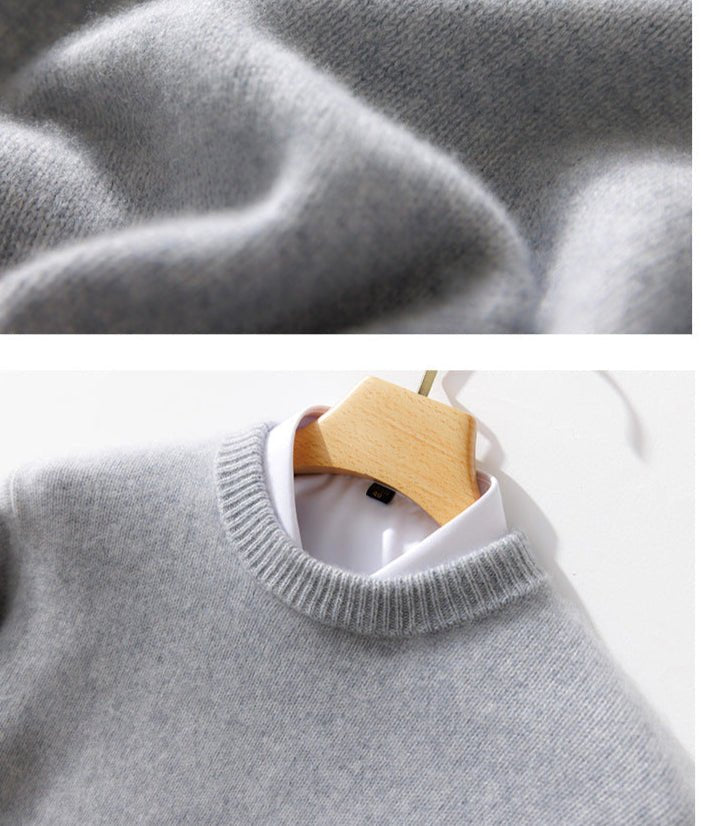 Thick Natural Wool Sweater With Elastic Hem in Light Gray Hanging on a Wooden Hanger