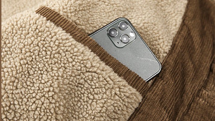 Thick Ribbed Velvet Jacket with Warm Lining featuring a cozy pocket holding a smartphone