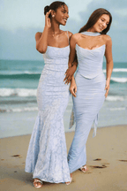 Two women wearing elegant Three-Piece Mermaid Style Dress in light blue by AM Vision RO at the beach