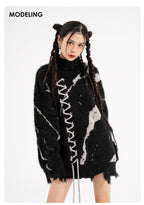Oversized Sweater With Dark Street Design And Distressed Details modeled by a young woman with unique hairstyle
