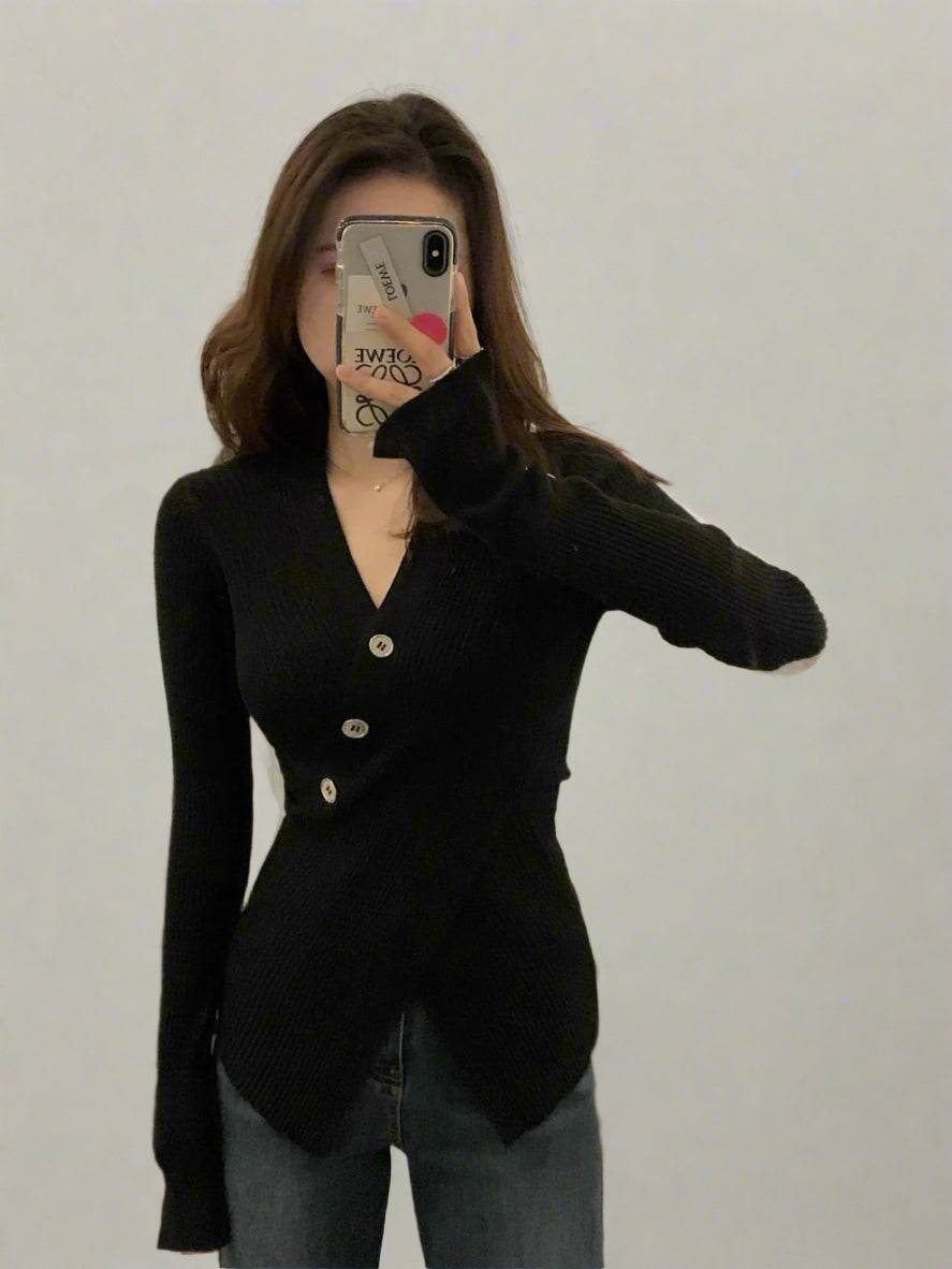 Black top slim-fit sweater with button detailing and a flattering silhouette