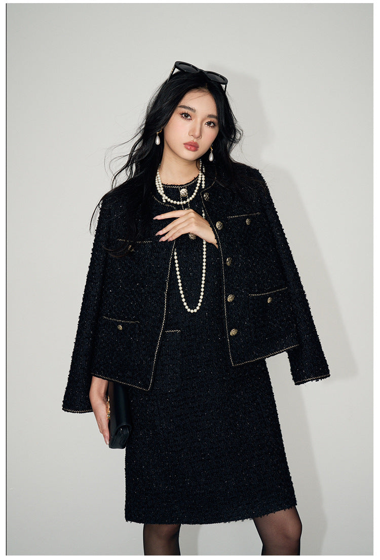 Elegant woman wearing a Tweed Short Wool Jacket paired with a stylish dress and accessories