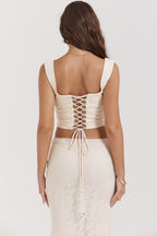 Back view of AM Vision RO Two-Piece Skirt and Top Set with lace-up detailing and elegant fabric