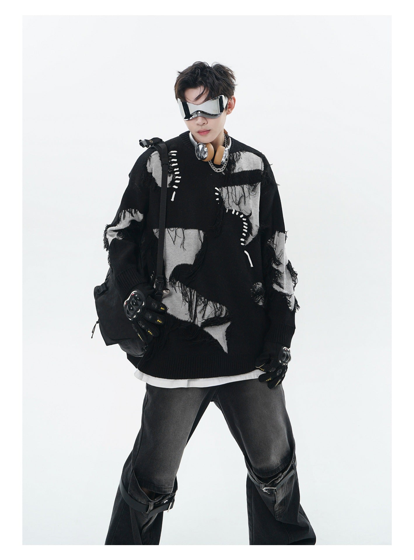 Unisex Streetwear Sweater With Irregular Pattern And Fringe Details styled with oversized pants and accessories