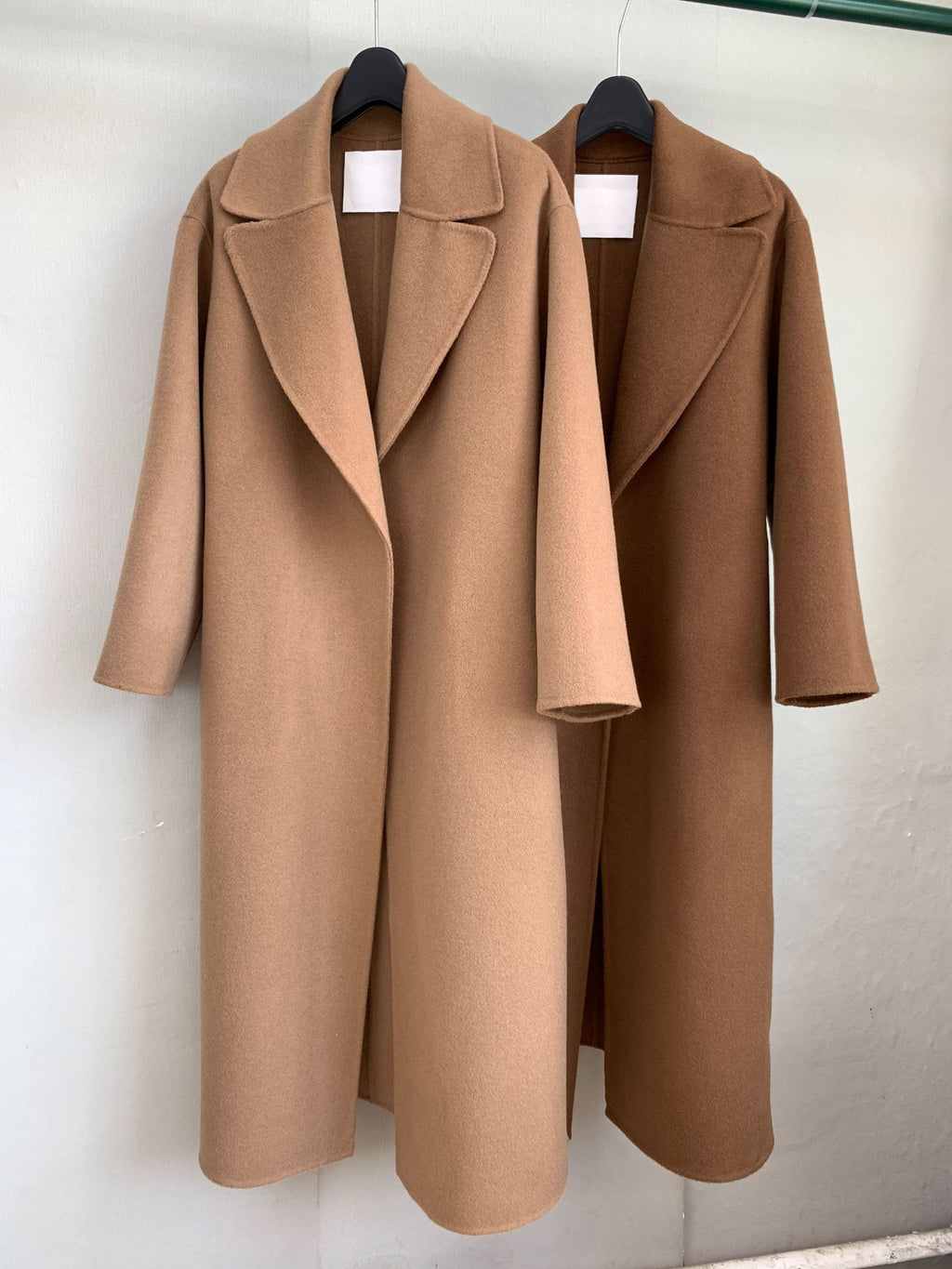 Urban Drift Double Face Wool Scarf Coat Camel and Caramel Edition displayed on hangers for a stylish look