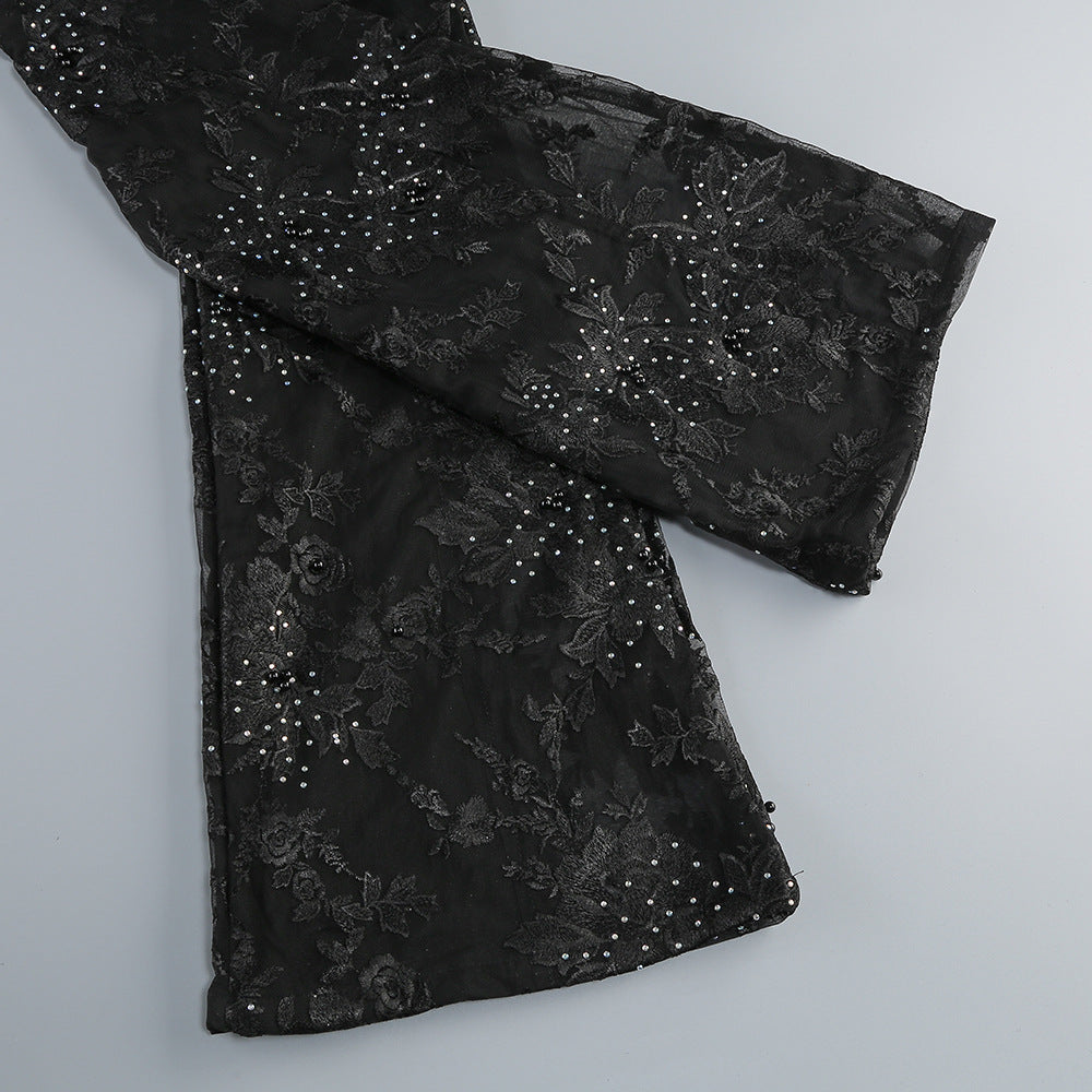 Valentina Crystal Lace V-Neck Jumpsuit featuring intricate lace detailing and shimmering crystals