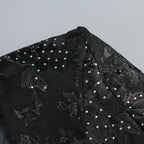 Close-up of the Valentina Crystal Lace V-Neck Jumpsuit showcasing intricate beading and floral lace details