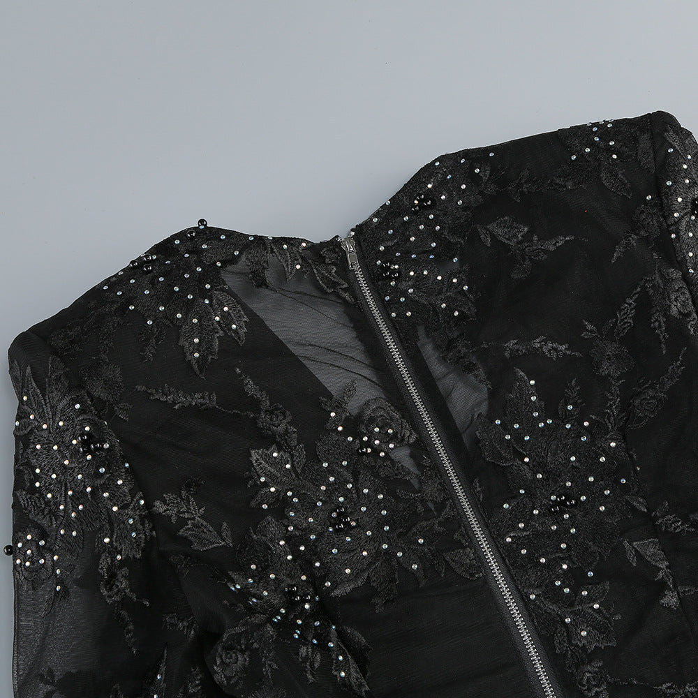 Valentina Crystal Lace V-Neck Jumpsuit featuring intricate lace design and sparkling crystals