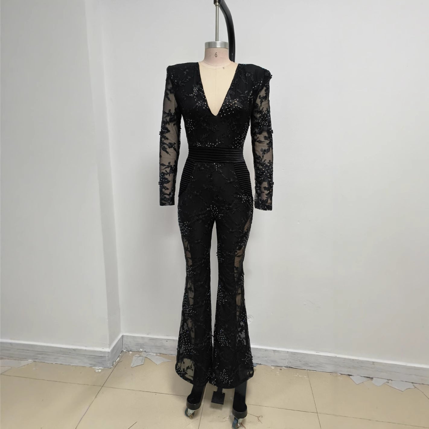 Valentina Crystal Lace V-Neck Jumpsuit in Black featuring a stunning lace design and fitted silhouette