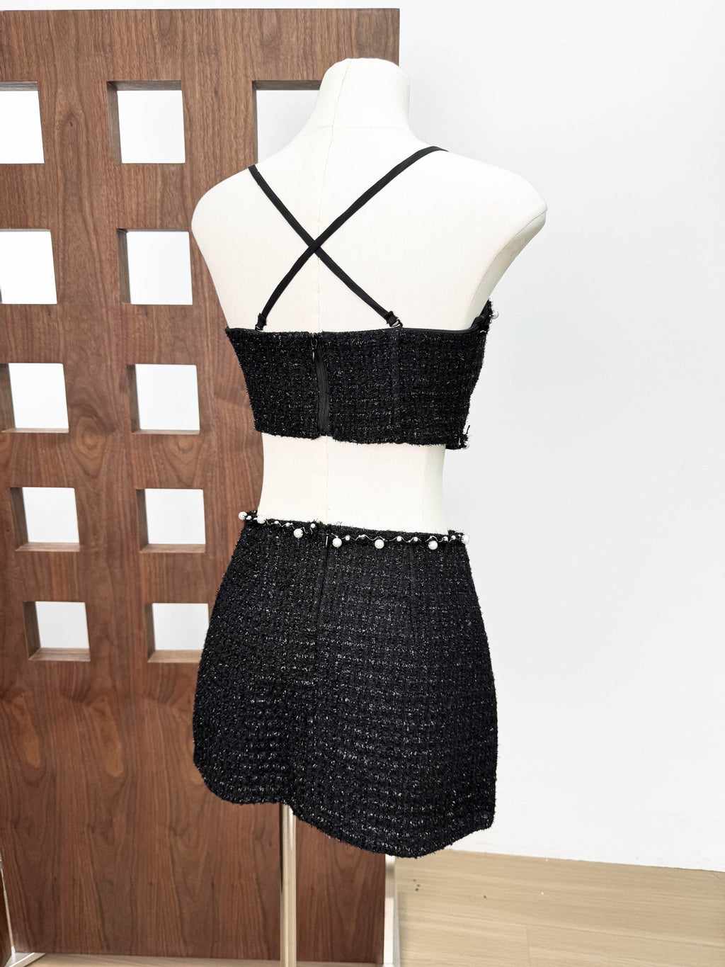 Back view of the Valeria Tweed Set Jacket, Bra, Skirt in black with unique detailing and cross-back straps