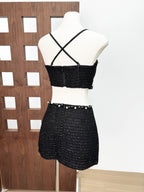 Back view of the Valeria Tweed Set Jacket, Bra, Skirt in black with unique detailing and cross-back straps